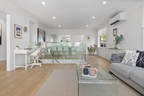 Lounge room with smart TV, Air Con and work station.