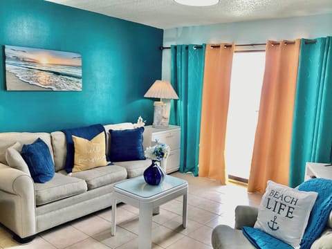 Curl up in the coastal chic living room & stream your favorites on the smart TV​