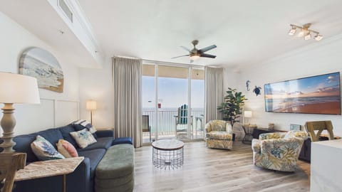 Open concept living area with gulf views and sleeper sofa for 2 guests