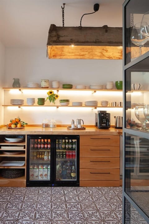 Part of the kitchen is given over to a bar area.