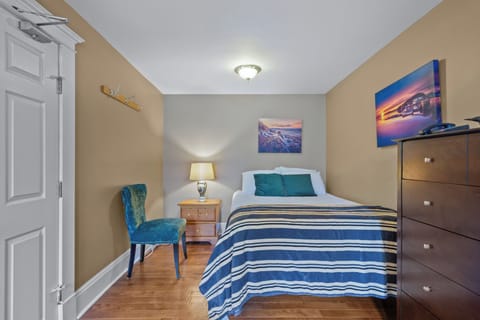 Cozy bedroom with comfortable bed and soft lighting — perfect for restful nights