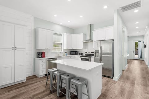 Spacious kitchen and open concept living area that leads to the pool