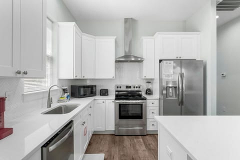 Spacious kitchen and open concept living area that leads to the pool