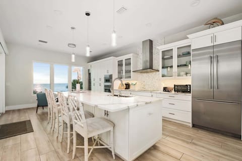 Start your mornings at the bright breakfast bar, where seating for four makes it the perfect place for casual meals, coffee, or evening wine with friends.