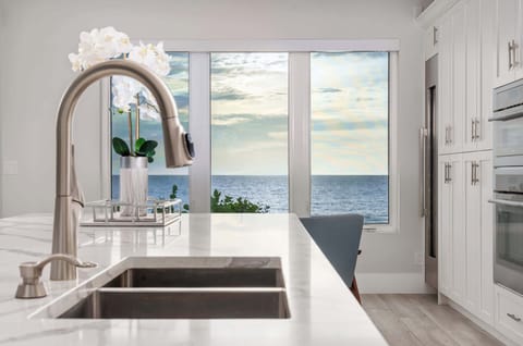 Cook with a view! This modern kitchen sink and prep space overlook the sparkling ocean, making even dishwashing a serene experience.