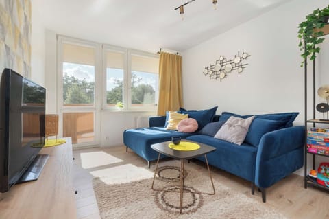 Living room with a comfortable sofa and TV. 