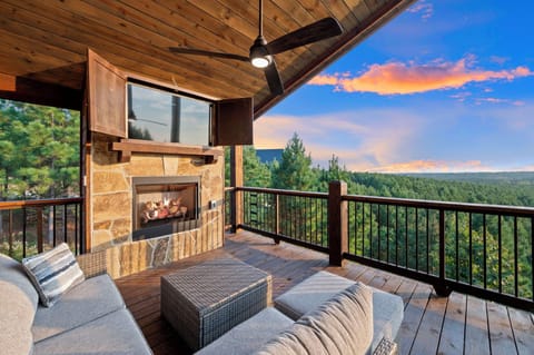 Welcome to The Skyline, your dreamy 5 bedroom cabin escape; Relax in outdoors with our fireplace seating area