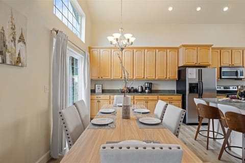 Dining area for six with open flow to kitchen and patio for easy hosting