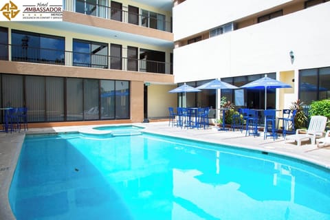 Soak up the sunshine by the sparkling pool and seating.