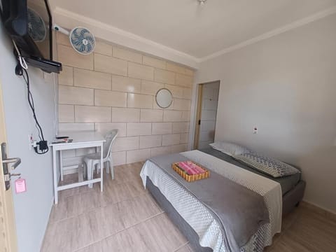 Basic Triple Room, 1 Bedroom, Courtyard View | Laptop workspace, blackout drapes, free WiFi, bed sheets