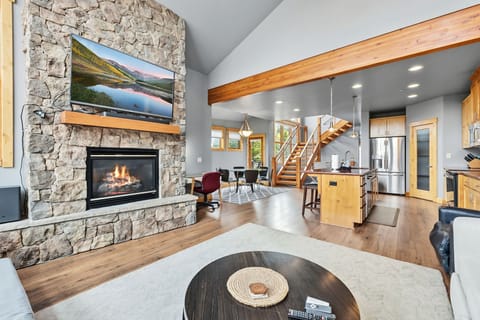 Living room: Decorative fireplace, 65” Smart TV