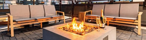 Watch the sunset from the rooftop with friends gathered close by, the perfect spot to kick off a night out or toast a group celebration