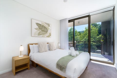 Rest easy in this peaceful, light-filled bedroom designed for comfort and calm