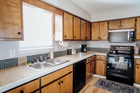 Fully equipped kitchen with modern appliances.