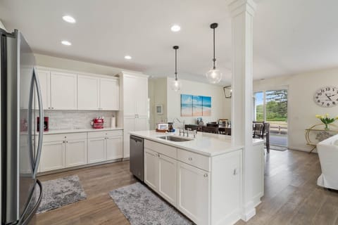 Mingle in the open-concept kitchen, a layout that keeps everyone connected.