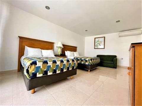 Relax with extra floor space, lounge sofa, and cool air.