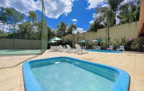 Cool off in the splash pool while friends lounge nearby.