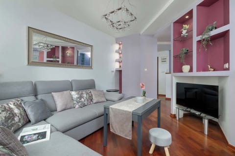 Enjoy your favorite shows on the flat-screen television in the elegant living area.
