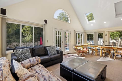 Bright open-concept living room with comfortable seating