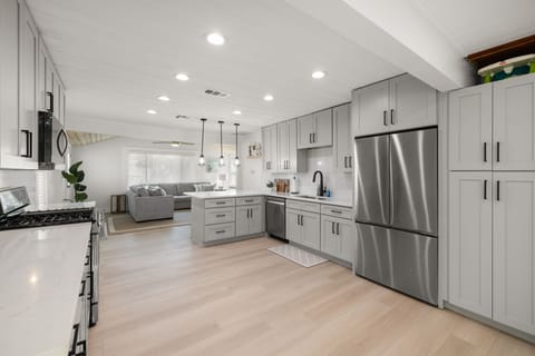 Fully stocked kitchen with open plan floor plan living space