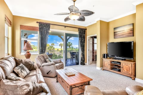 ​Kick back in the plush recliner and soak in the picturesque view of swaying palms and blue skies. For the full experience, open the doors and lower the remote-controlled screen to let the ocean breeze and the sound of the waves fill the room.