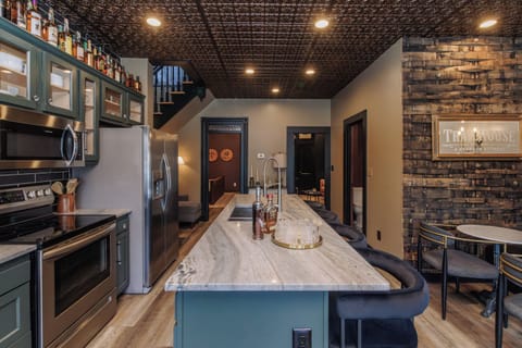 Gather around the large kitchen island for drinks and conversation.