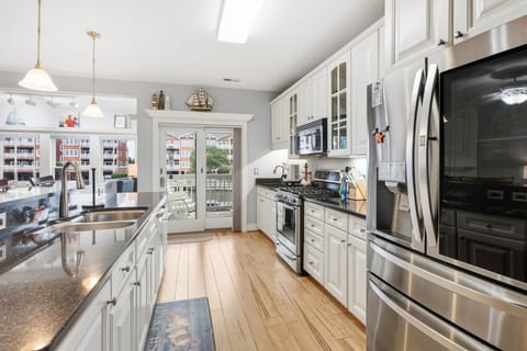 Cook up your favorite dishes in the fully equipped kitchen with sleek appliances and counter bar seating.