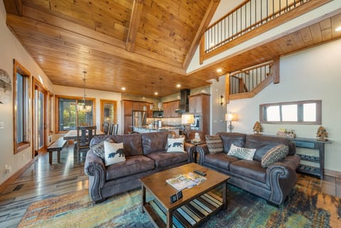 Plush Leather Seating in the Living Room, Leads to Dining and Kitchen