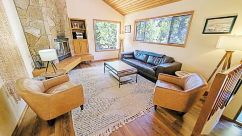 The living area features a classic Sunriver Lava Rock face Fireplace