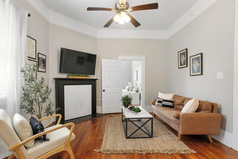The living room design is inspired by a lively modern showroom layout.