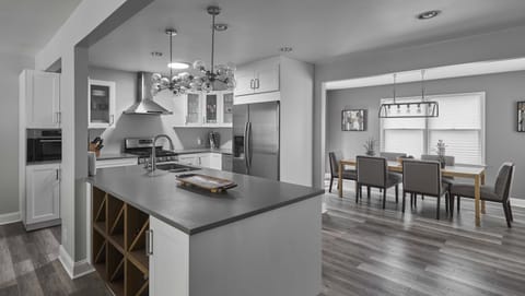 The sleek, open kitchen offers ample space & every home comfort​