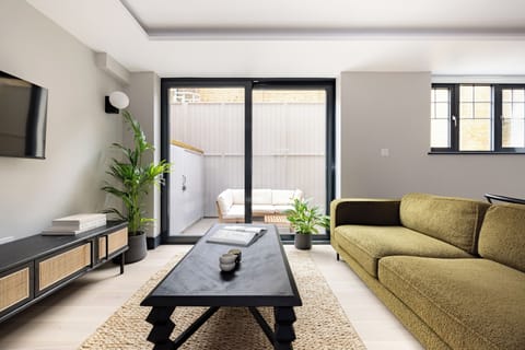 Apartment, 3 Bedrooms, Patio | Living area | 44-inch Smart TV with cable channels