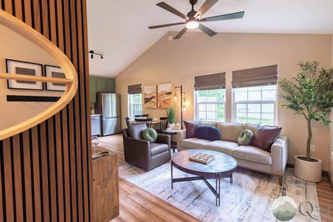 Open-concept living area creates welcoming space for socializing or simply relaxing in style and comfort.