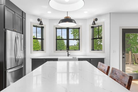 Sink overlooks front yard, hottub. Fully stocked