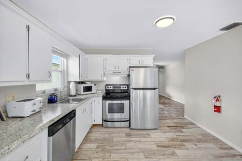 Newer appliances and all the cookware and dishes to prepare a feast or a quick beach snack