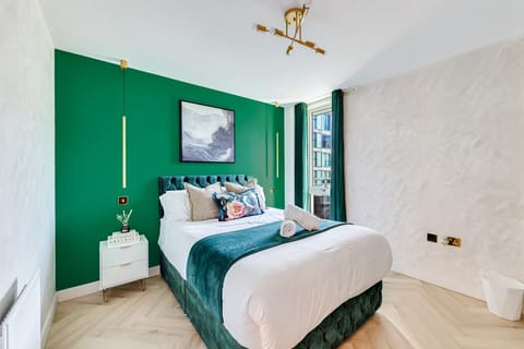 The bedroom has a comfortable double bed with fresh linen and towels provided