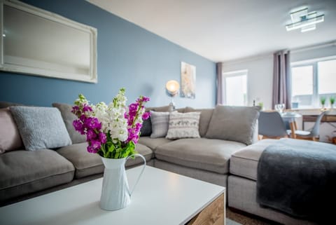 Snuggle on the large comfy sofa and rest those feet after a long day exploring