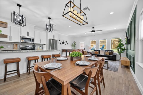 Open-concept living and dining area designed for gathering and entertaining.