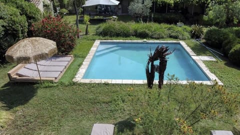 shared pool surrounded by trees and Provençal flowers