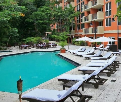 Resort-style pool with lounge chairs for relaxing days
