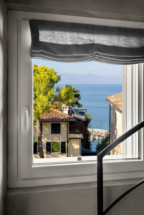 Luxury Room, Lake View | Minibar, in-room safe, desk, laptop workspace