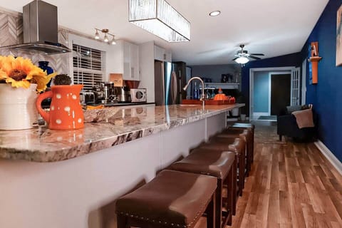 Sit up at the sleek granite top breakfast bar and keep the chef company as they cook in a beautiful Chefs kitchen