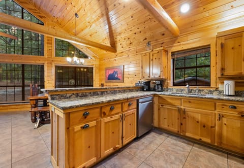 Spacious kitchen with island, vaulted ceilings, and natural light