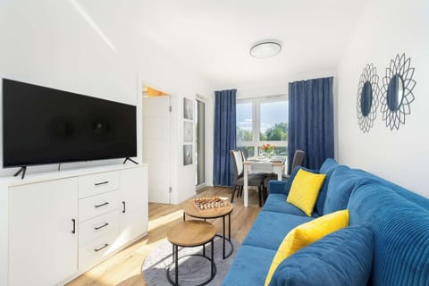 Bright living room with TV.