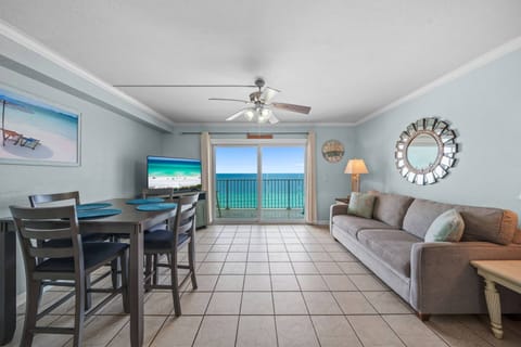 The living room that has it all — comfy seating, flat-screen TV, dining for four, and a Gulf view that will take your breath away every single time!
