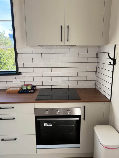 Spacious kitchen with ample bench space and a coffee & tea station.