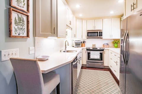 There is plenty room in this bright & cheery kitchen to prepare your family's meals.