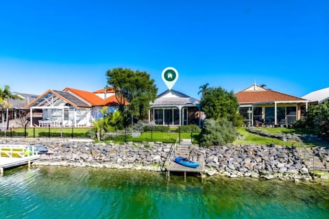 Enjoy direct lake access just beyond the private backyard; glide out on the provided kayak for a peaceful paddle or relax by the tranquil water.
