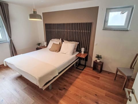 Furniture, Bed, Interior Design, Bedroom, Floor, Flooring, Wood, Bedding, Bed Sheet, Lighting