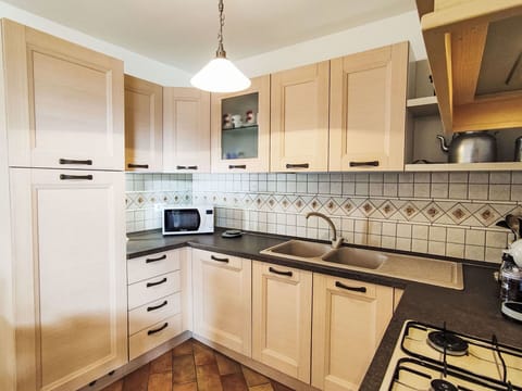 Kitchen, Cabinetry, Countertop, Kitchen Appliance, Major Appliance, Wood, Flooring, Interior Design, Stove, Kitchen Stove